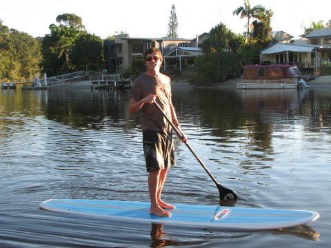 rich-sup Handsome man stand up paddling